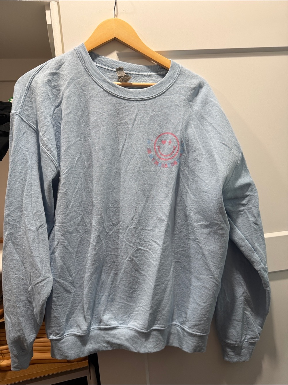 Gildan Light Blue Women’s Crewneck Sweater with Pink Smiley Accent